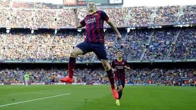 Andres Iniesta celebrates a goal during the Spanish league football match FC Barcelona vs Osasuna at Camp Nou, in Barcelona. Josep Lago / AFP / March 16, 2014.