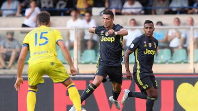 Cristiano Ronaldo in action with Chievo's Luca Rossettini. Reuters