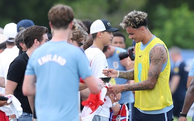 England defender Nico O'Reilly signs autographs during a training session at Palm Beach Gardens, Florida. AFP