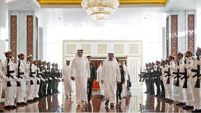 Sheikh Mohammed bin Zayed, Crown Prince of Abu Dhabi Deputy Supreme Commander of the Armed Forces, greets Sheikh Tamim bin Hamad Al Thani, Emir of Qatar, at the Presidential Airport. Ryan Carter / Crown Prince Court - Abu Dhabi