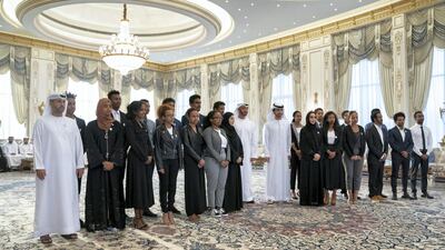Sheikh Mohamed bin Zayed, Crown Prince of Abu Dhabi and Deputy Supreme Commander of the UAE Armed Forces, stands for a photograph with scholarship students from Eritrea and Ethiopia, who are studying in the UAE, during a Sea Palace barza. Hamad Al Kaabi / Ministry of Presidential Affairs