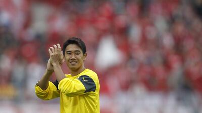 Borussia Dortmund's Shinji Kagawa applauds supporters after their Bundesliga win over Freiburg on Saturday. Ina Fassbender / Reuters / September 13, 2014