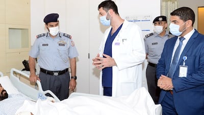 Faris Khalaf Al Mazrouei, commander-in-chief of Abu Dhabi Police, offered his support to people in hospital after a deadly gas cylinder explosion at a restaurant in Khalidiya on Monday. Photo: Abu Dhabi Police