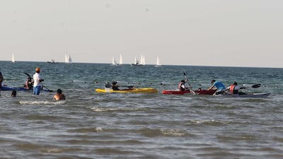 Participants kayak during the Al Gharbia Watersports Festival.