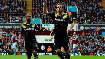 Frank Lampard celebrates scoring his and Chelsea's first goal against Aston Vill. Paul Ellis / AFP
