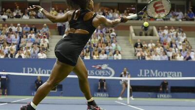 Serena Williams plays a return to sister Venus during their quarter-final match in the US Open on Tuesday in New York City. Justin Lane / EPA