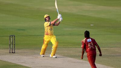 Team Abu Dhabi's Luke Wright goes for big hit. Chris Whiteoak / The National