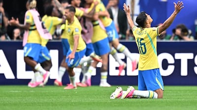 Brazil players celebrate after Gabriel Martinelli's late winner. Reuters