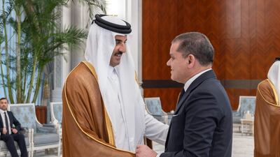 Sheikh Tamim shakes hands with Abdul Hamid Dbeibah, Prime Minister of Libya's Government of National Unity. AFP