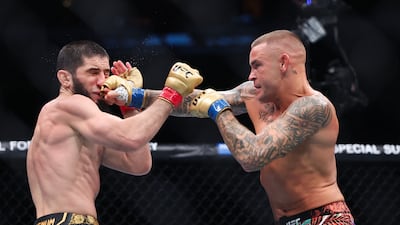 Dustin Poirier lands a punch on Islam Makhachev during their lightweight title bout at UFC 302. AFP