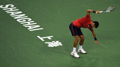 Novak Djokovic of Serbia smashing his racket after losing a point against Roberto Bautista Agut of Spain in their men's singles semi-finals match at the Shanghai Masters tennis tournament in Shanghai. Johannes Eisele / AFP