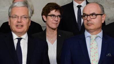 Germany's Defence Minister Annegret Kramp-Karrenbauer and Belgium's Defence Minister Didier Reynders during the NATO defence ministers meeting at the Alliance headquarters in Brussels on Thursday. Reuters