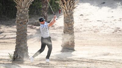England's Justin Rose of England plays his second shot on the 8th hole on his way to a second-round 72. Getty