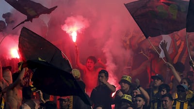 Penarol fans in Uruguay celebrate a goal in the 79th minute against Nacional during their derby match in Montevideo on Sunday. The match ended in a 1-1 draw and Penarol stayed atop the table. Andres Stapff / Reuters