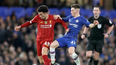 Billy Gilmour battles for the ball with Curtis Jones. AP Photo