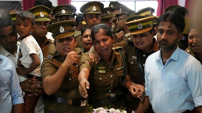 Sri Lanka prison officials in Colombo mourn beside the bodies of colleagues killed in clashes between rival groups of inmates at Negombo Prison. Reuters