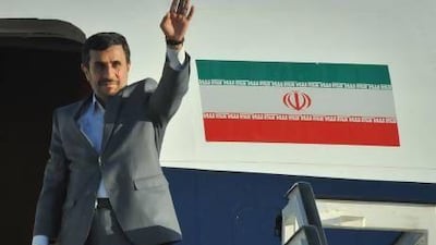 Iranian President Mahmoud Ahmadinejad waves before boarding his plane at Jose Marti airport, on January 12, 2012, upon departure from Cuba after an official visit. Adalberto Roque AFP Photo