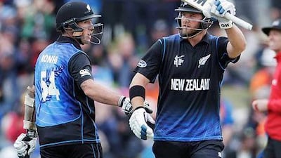 New Zealand batsman Corey Anderson, right, celebrates his 50 runs alongside teammate Luke Ronchi during their Cricket World Cup match against Sri Lanka in Christchurch, February 14, 2015. REUTERS/Anthony Phelps