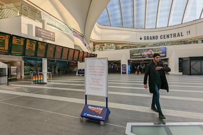 A passenger walks through a near-empty Birmingham New Street station. PA