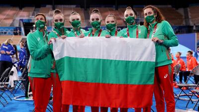 Team Bulgaria poses with coaches after winning the gold medal.