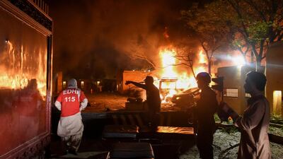 Rescue worker and police officers arrive after an explosion at a luxury hotel in Quetta, Pakistan. Reuters