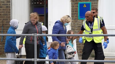 Young children are taken into Dover on June 21, 2022. PA