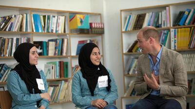 Britain's Prince William, visits with Palestinian students inside a school run by UNRWA in the Al-Jalzoun refugee camp near the West Bank city of Ramallah. Fadi Arouri / AP Photo