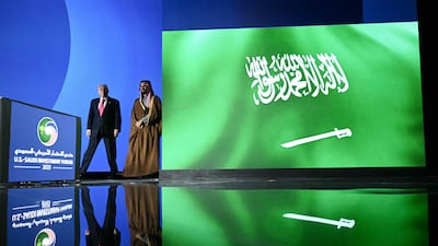 Mr Trump and Prince Mohammed arrive at the forum. AFP