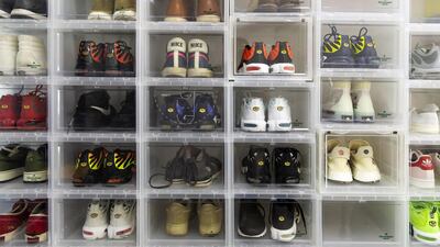 Trainers sit in stacked clear boxes at the office of Nice, an online sneaker trading platform, in Beijing. Across China, more than 10 million monthly active users frequent online-resale apps for trainers, according to Chinese data-mining company QuestMobile. Bloomberg