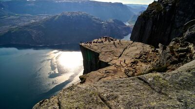 Travellers atop Norway's Pulpit Rock. Courtesy Andreas Gruhle / visitnorway.com / Innovation Norway