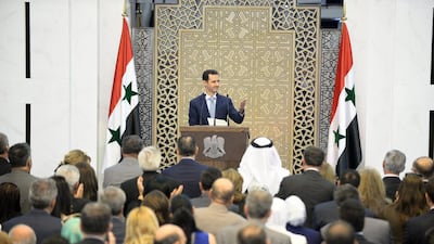 Syrian president Bashar Assad delivers a speech in Damascus on Sunday, July 26. (SANA via AP)