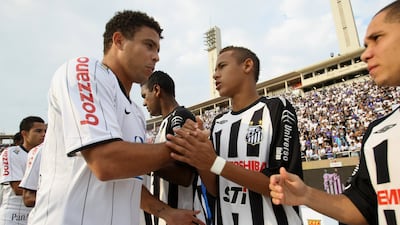 Brazil legend Ronaldo, left, of Corinthians, greets Neymar, of Santos, before the 2009 Paulista Championship fixture in May 2009. AFP