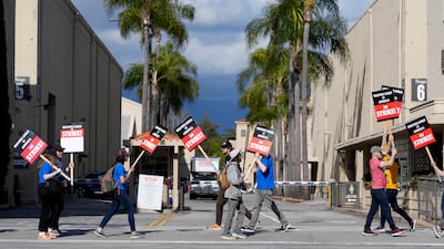 Members of the Writers Guild of America outside an entrance to Warner Bros on Tuesday. AP Photo