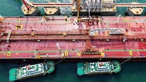 A crude oil tanker unloads at the oil terminal of the port in Qingdao, in China’s eastern Shandong province on April 28, 2026. China has managed to cut its petroleum purchases substantially. AFP