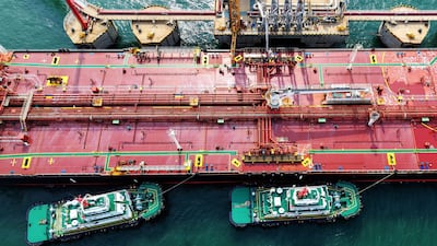 A crude oil tanker unloads at the oil terminal in Qingdao port, in China’s eastern Shandong province, on April 28. AFP / China OUT