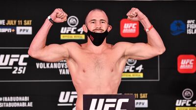 Roman Bogatov of Russia poses on the scale during the UFC 251 official weigh-in.