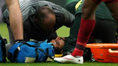Salah receives treatment after sustaining an injury. Owen Humphreys / AP Photo
