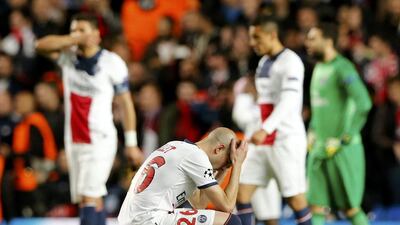 Paris Saint-Germain player Christophe Jallet and teammates react after being defeated by Chelsea during their Champions League quarter-final second leg match on Tuesday. Stefan Wermuth / Reuters / April 8, 2014