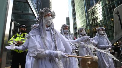 Environmental protesters demonstrate in the City of London. Protests were held on Friday across 26 countries, days before world leaders meet in Glasgow for Cop26. EPA
