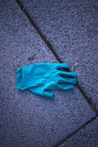 Discarded plastic gloves are becoming a common sight world over. AFP