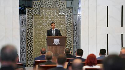 Syrian President Bashar al-Assad addresses parliament in Damascus. AP