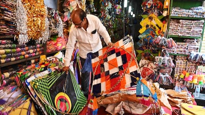 A vendor arranges kites at a shop in Hyderabad. AFP