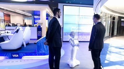 Emirates NBD’s robot assistant, Pepper, greets visitors at the Emirates NBD Future Lab in Dubai. Reem Mohammed / The National