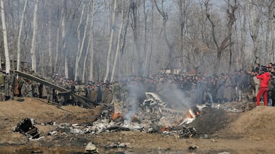 Kashmiri villagers gather near the wreckage of an Indian aircraft after it crashed in the Budgam area on the outskirts of Srinagar. AP Photo