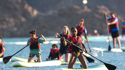 Up to 1,000 people took part in the first Dubai Stand-Up Paddle in Hatta on Saturday. All photos: Victor Besa / The National