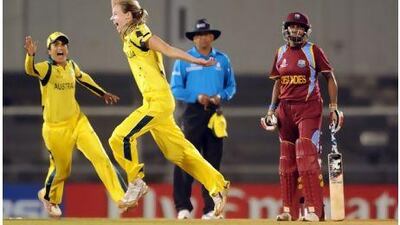 Australian cricketers Lisa Sthalekar, left, and Elysse Perry, centre, celebrate the last wicket of the West Indies during the final match of the Women's World Cup 2013 in Mumbai, India on Sunday. Indranil Mukherjee / AFP