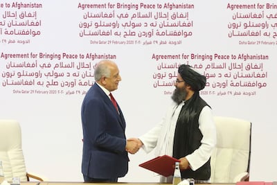 US peace envoy Zalmay Khalilzad (L) and Abdul Ghani Baradar, the Taliban group's top political leader sign a peace agreement between Taliban and American officials in Doha, Qatar in February 2020. AP