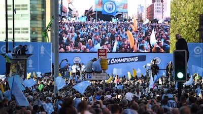 Manchester City football fans line the streets as they try to see the team show off the trophies in an open-top bus parade through Manchester, northern England, to celebrate winning the 2019 Premier League title, the FA Cup and English League Cup. Pep Guardiola saluted Manchester City's history makers after they clinched the domestic treble with a swaggering 6-0 rout of Watford in the FA Cup final on Saturday. Just a week after winning a second successive Premier League crown, City's record-equalling FA Cup final victory made them the first English club to win the English title, FA Cup and League Cup in the same season. AFP