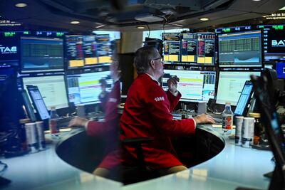 A trader works on the floor of the New York Stock Exchange (NYSE). AFP