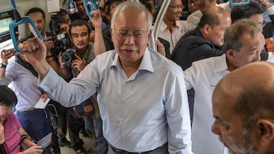 Najib Razak on board the Malaysia Mass Rapid Transit train during its phase one launching on the outskirts of Kuala Lumpur in 2016. AFP